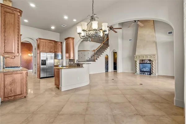 a view of kitchen with furniture and refrigerator