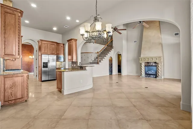 a view of kitchen with furniture and refrigerator