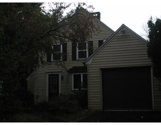 63 Brook Road Weston, MA 02493 - Photo 1 of 1 a front view of a house with a garden