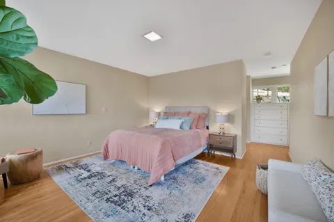 a bedroom with a bed and a couch