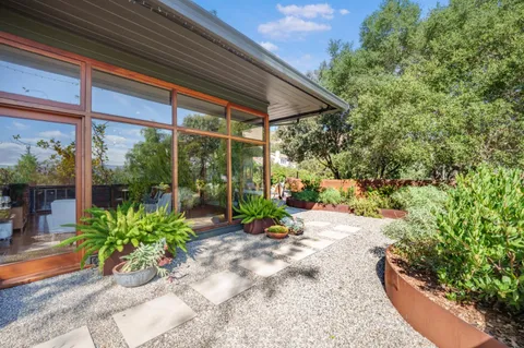 a view of a garden with patio