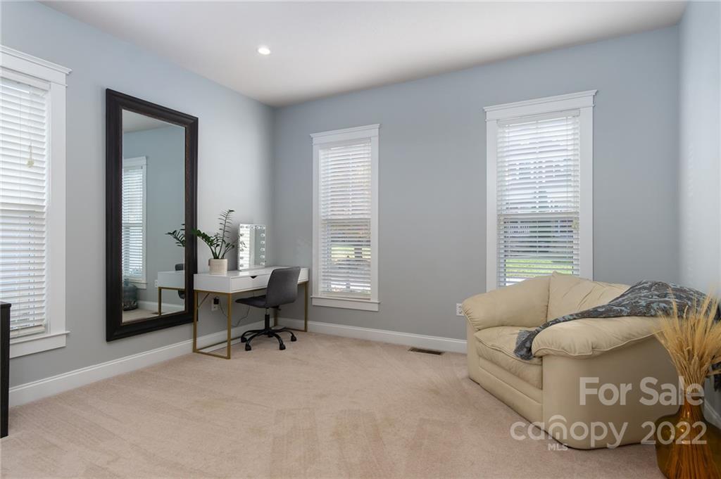 225 Nut Hatch Loop Arden, NC 28704 - Photo 17 of 48 a living room with furniture and a window