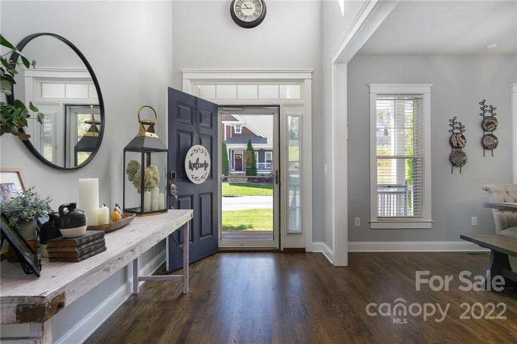 225 Nut Hatch Loop Arden, NC 28704 - Photo 2 of 48 a view of living room with furniture and mirror