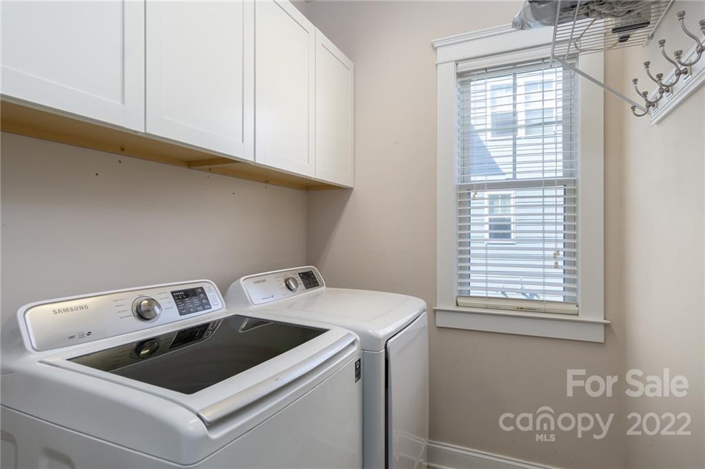225 Nut Hatch Loop Arden, NC 28704 - Photo 21 of 48 a utility room with dryer and washer