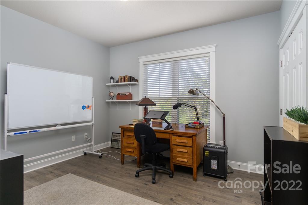 225 Nut Hatch Loop Arden, NC 28704 - Photo 23 of 48 a view of a workspace with furniture and a window