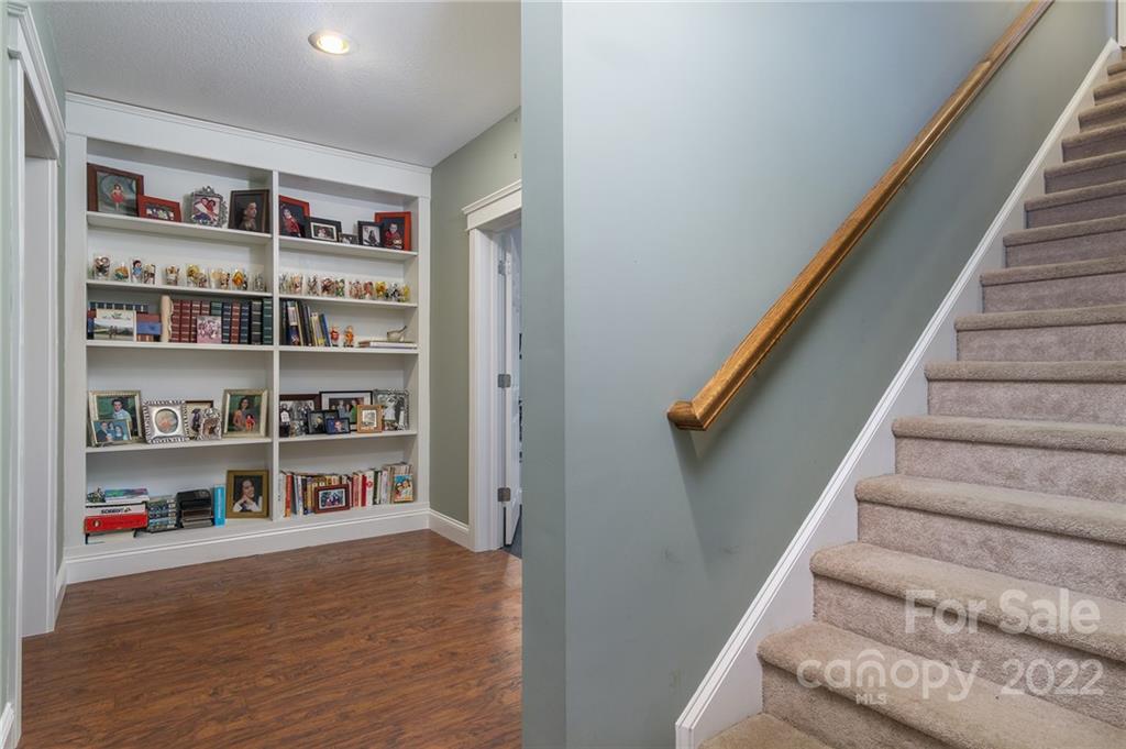 225 Nut Hatch Loop Arden, NC 28704 - Photo 28 of 48 a view of a hallway with shelf