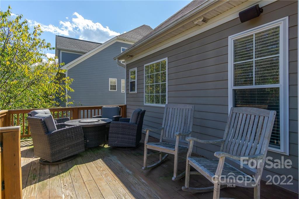 225 Nut Hatch Loop Arden, NC 28704 - Photo 38 of 48 a view of a deck with furniture