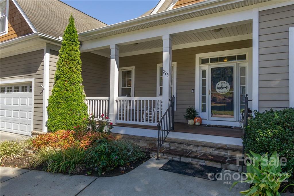 225 Nut Hatch Loop Arden, NC 28704 - Photo 4 of 48 front view of a house with a porch