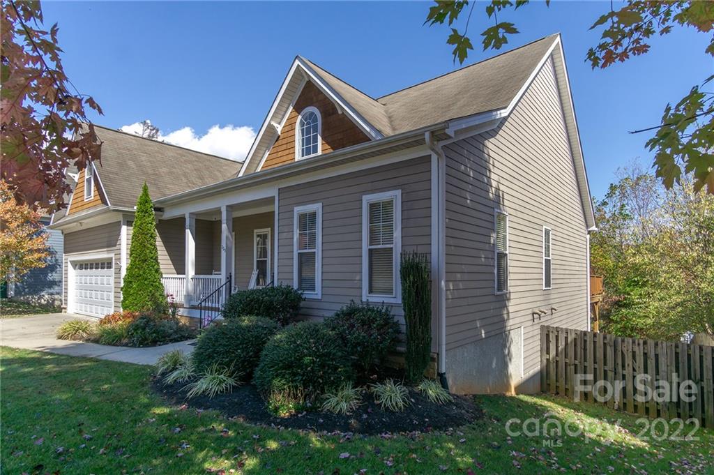 225 Nut Hatch Loop Arden, NC 28704 - Photo 45 of 48 a front view of a house with garden