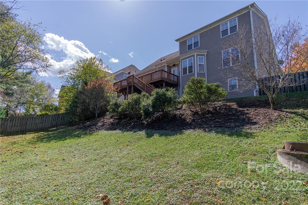 225 Nut Hatch Loop Arden, NC 28704 - Photo 47 of 48 a view of a house with a yard and plants