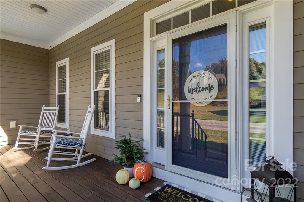 225 Nut Hatch Loop Arden, NC 28704 - Photo 5 of 48 a front view of a house with a potted plant