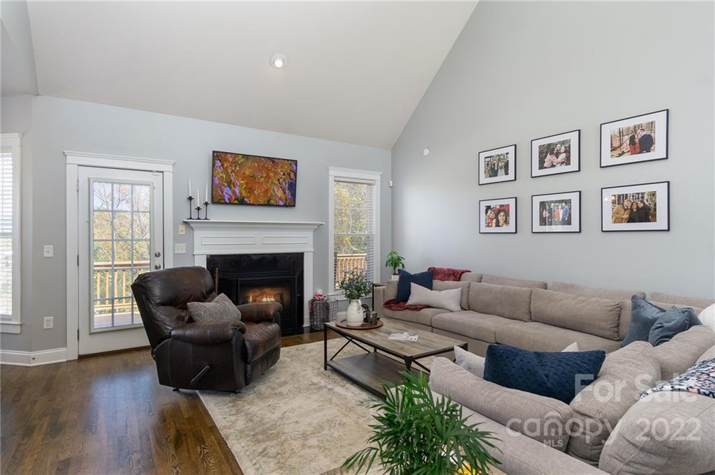 225 Nut Hatch Loop Arden, NC 28704 - Photo 9 of 48 a living room with furniture and a fireplace