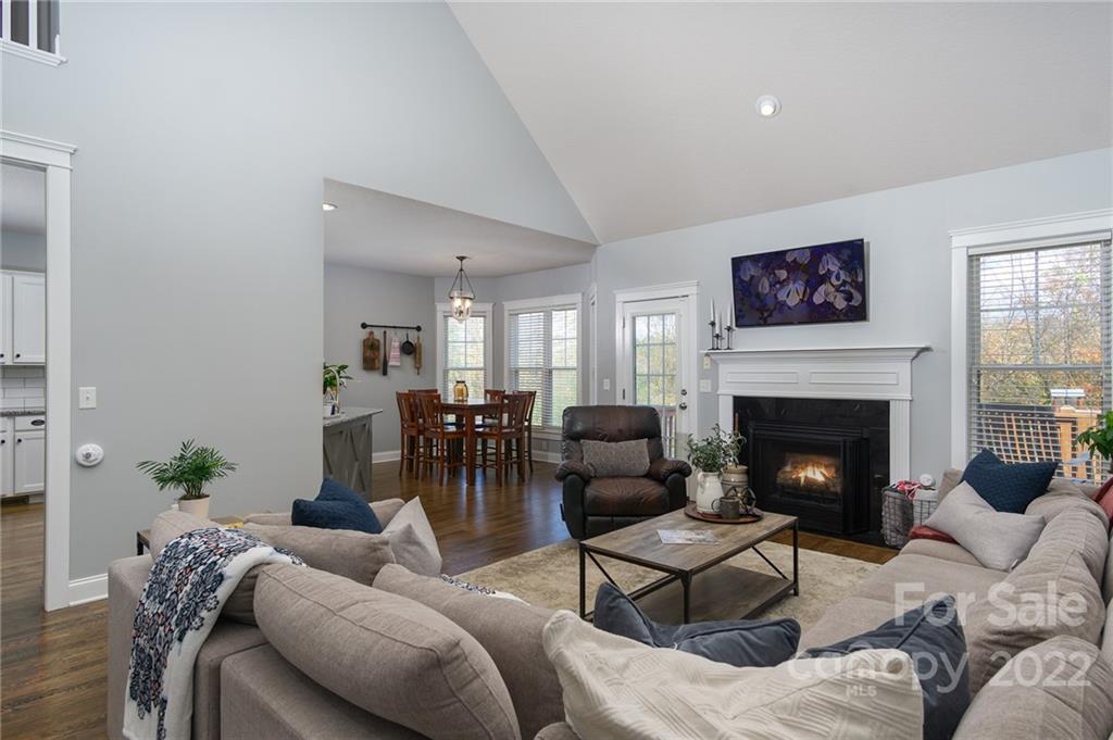 225 Nut Hatch Loop Arden, NC 28704 - Photo 10 of 48 a living room with furniture and a fireplace