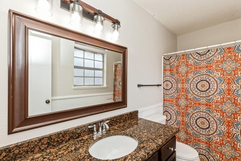 2028 Faulk Ferry Road Baker, FL 32531 - Photo 8 of 43 a bathroom with a granite countertop sink and a mirror