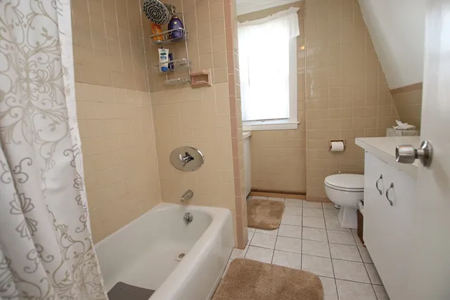 a bathroom with a bathtub sink and toilet