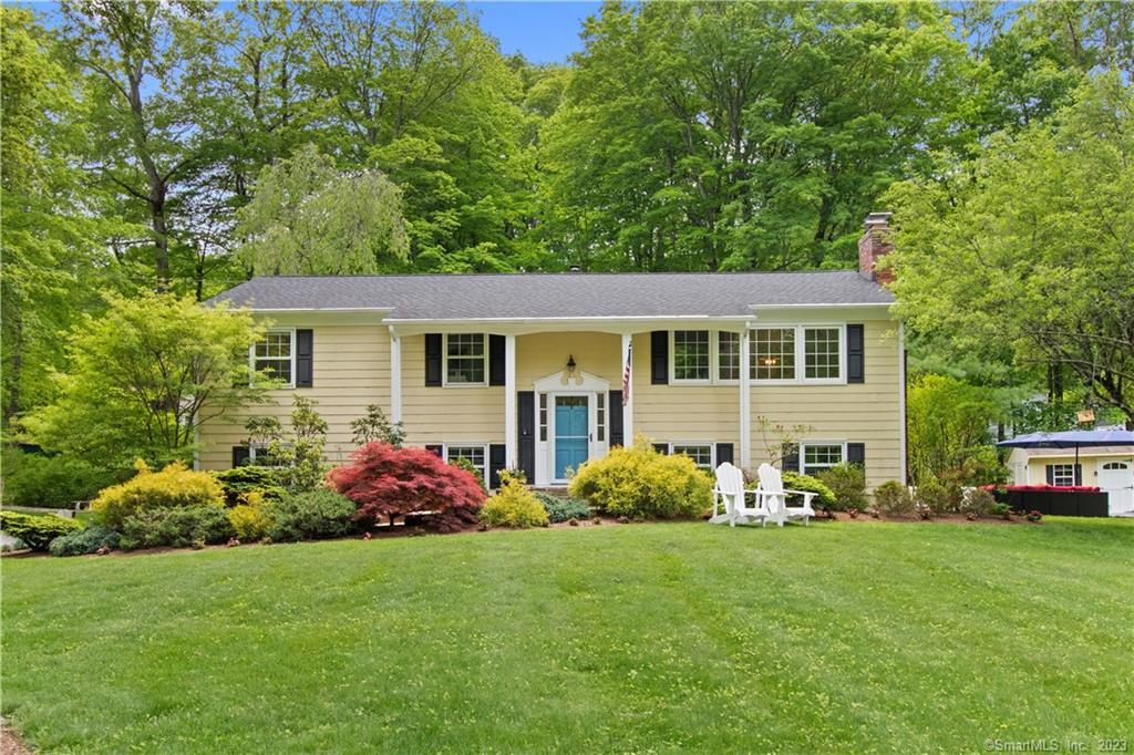 100 Haviland Road Ridgefield, CT 06877 - Photo 1 of 1 a front view of house with yard and green space