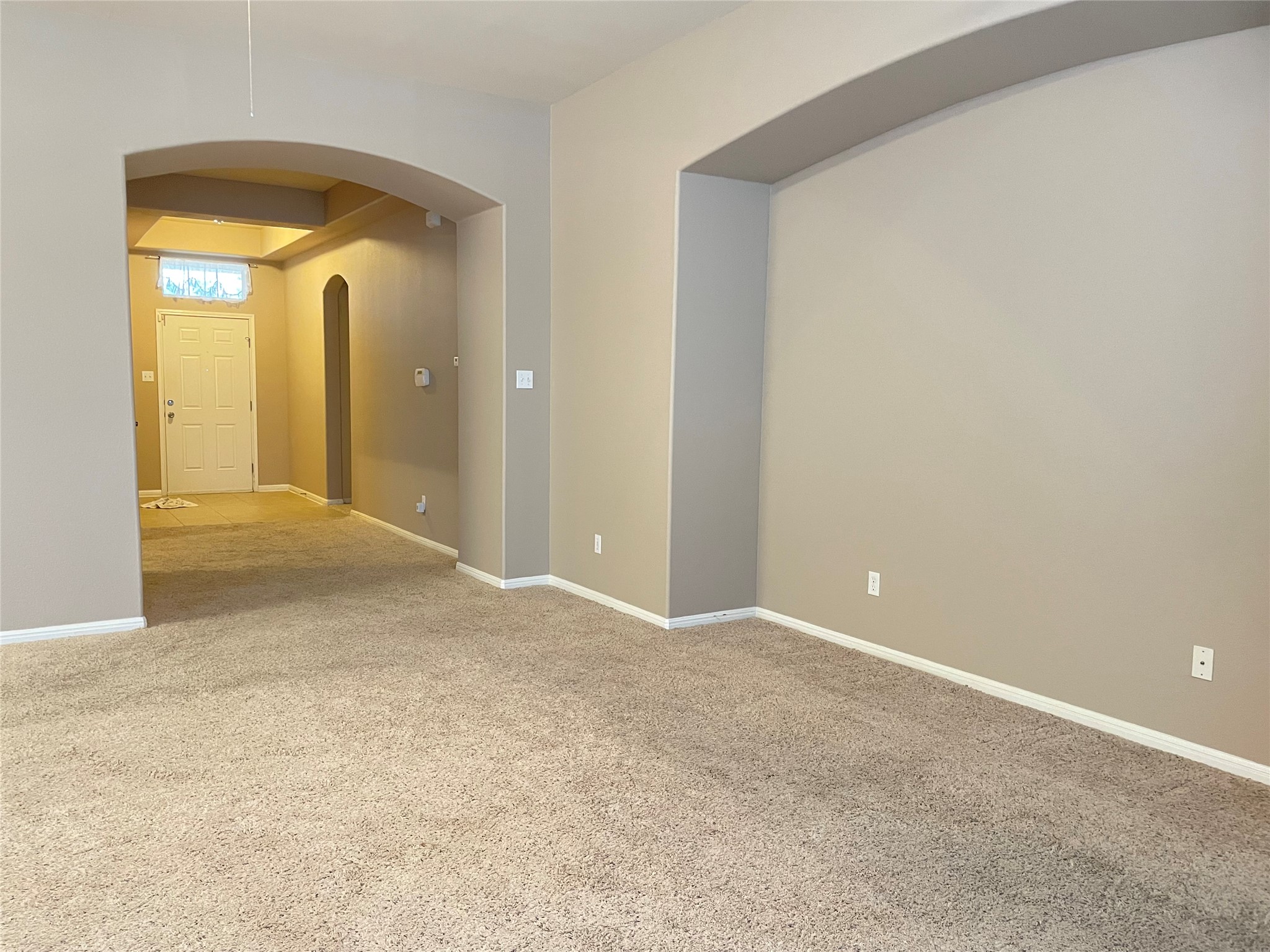 11713 Dunblane Way Austin, TX 78754 - Photo 2 of 22 Carpeted interior with neutral wall tones and white baseboards
