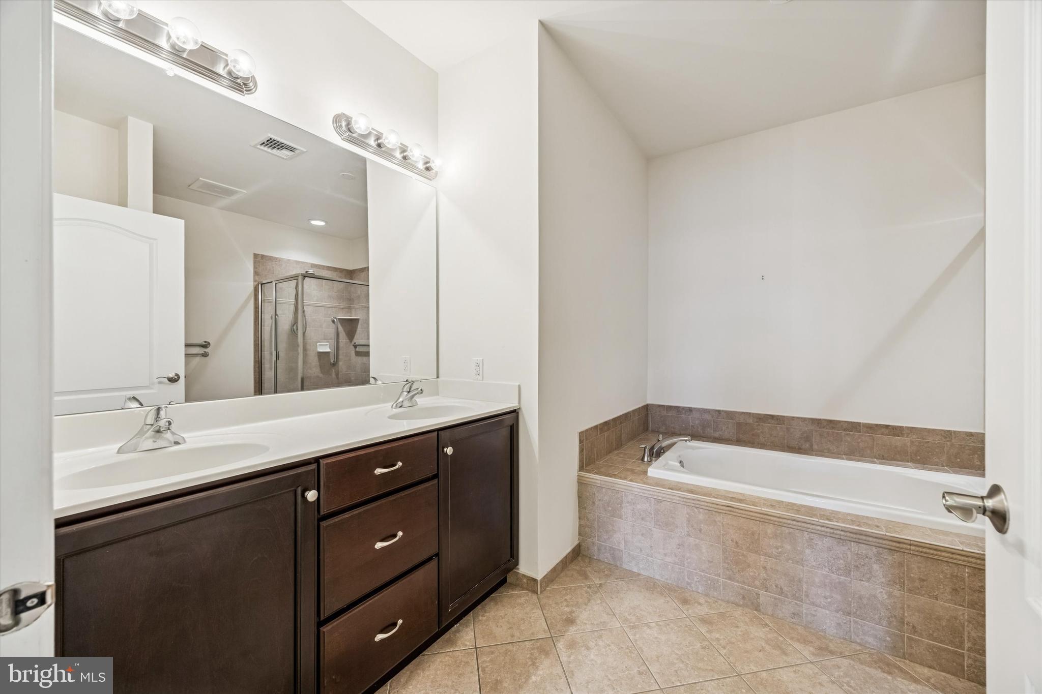 427 Carson Terrace Huntingdon Valley, PA 19006 - Photo 11 of 19 a bathroom with a tub sink and mirror