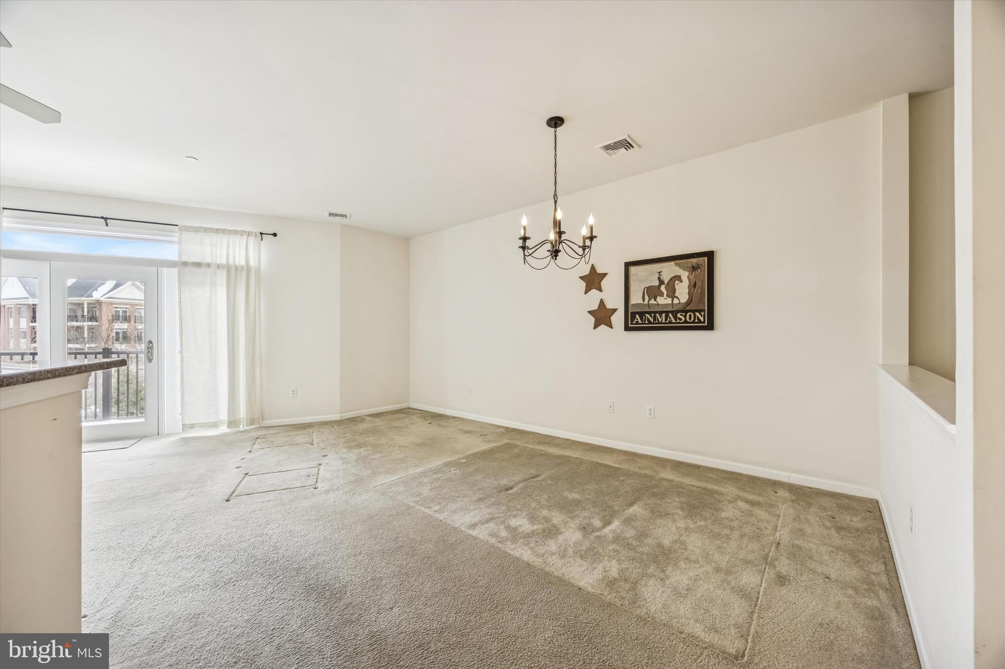 427 Carson Terrace Huntingdon Valley, PA 19006 - Photo 19 of 19 a view of a kitchen with a sink refrigerator and chandelier