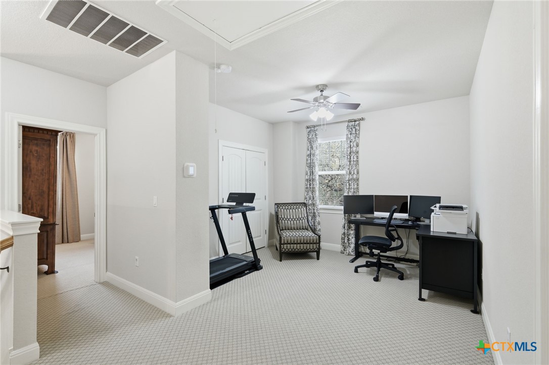 2608 Barbera Pass Austin, TX 78748 - Photo 15 of 39 a view of a workspace with furniture and a window