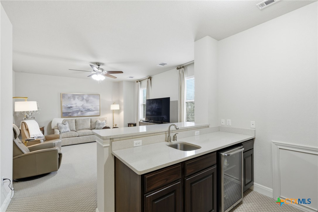 2608 Barbera Pass Austin, TX 78748 - Photo 19 of 39 a kitchen with a sink cabinets and wooden floor