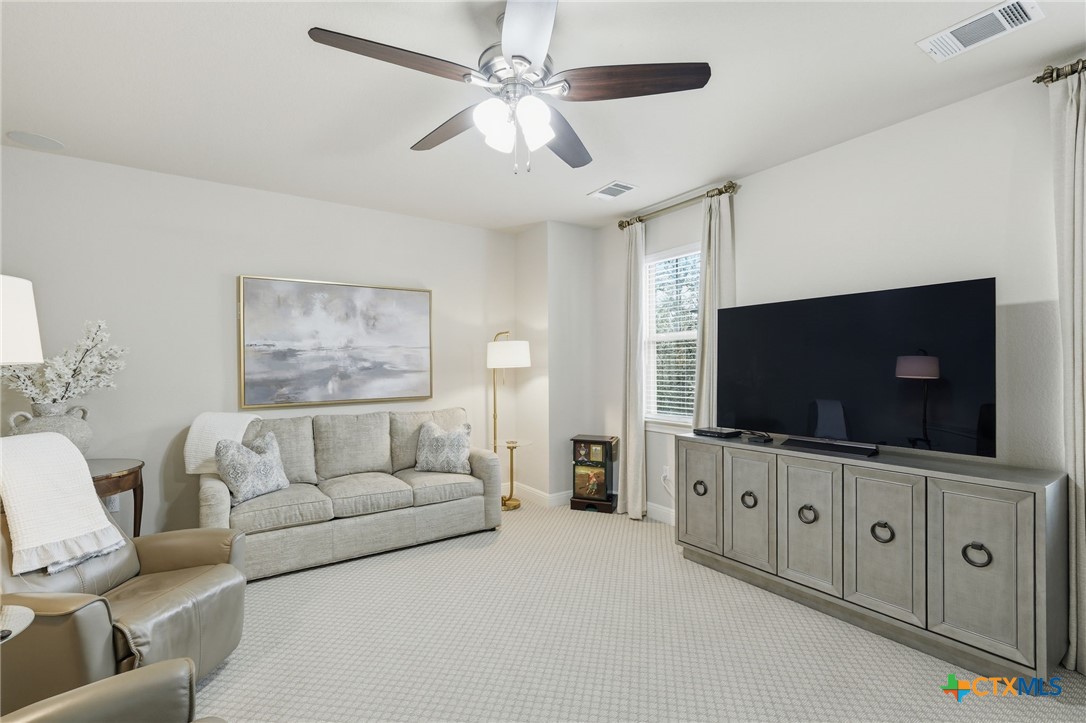 2608 Barbera Pass Austin, TX 78748 - Photo 20 of 39 a living room with furniture and a flat screen tv