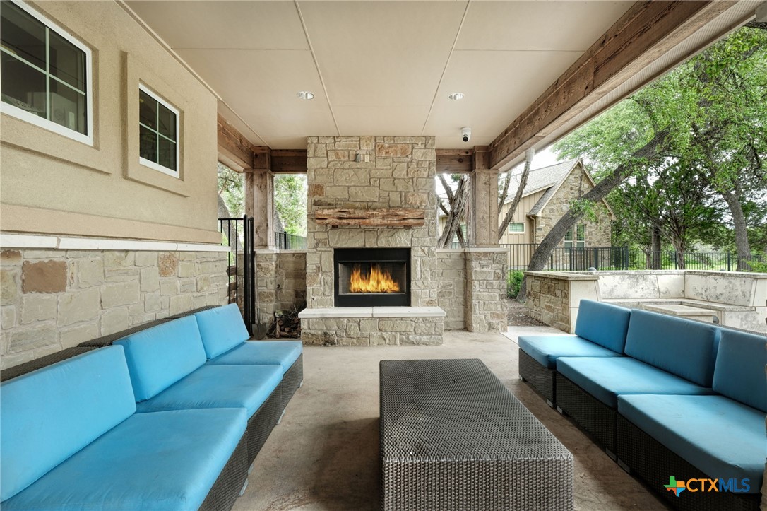 2608 Barbera Pass Austin, TX 78748 - Photo 28 of 39 a outdoor living space with patio furniture and a fireplace
