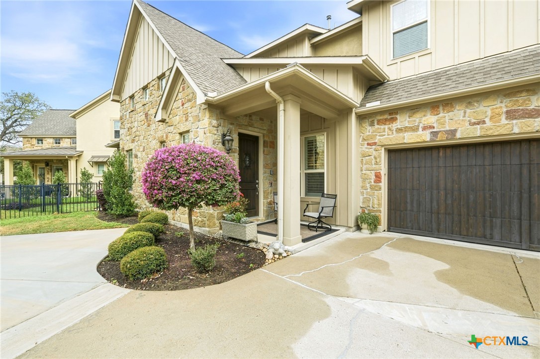 2608 Barbera Pass Austin, TX 78748 - Photo 3 of 39 a front view of a house with garden