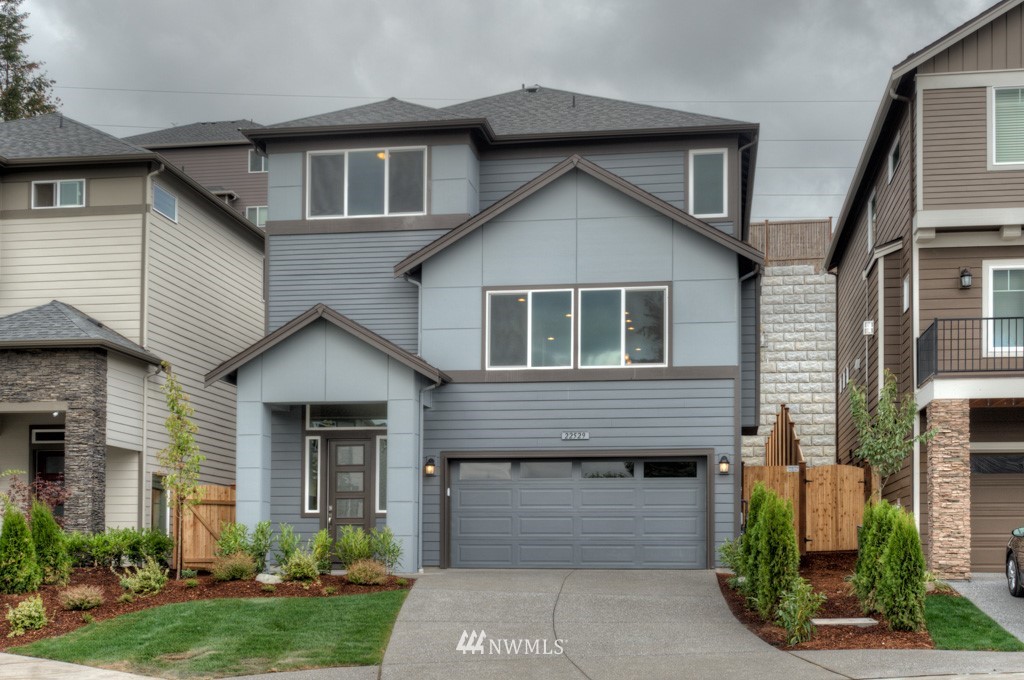 3920 242nd Street Southeast, Unit PT 4 Bothell, WA 98021 - Photo 1 of 23 a front view of a house with a yard and garage