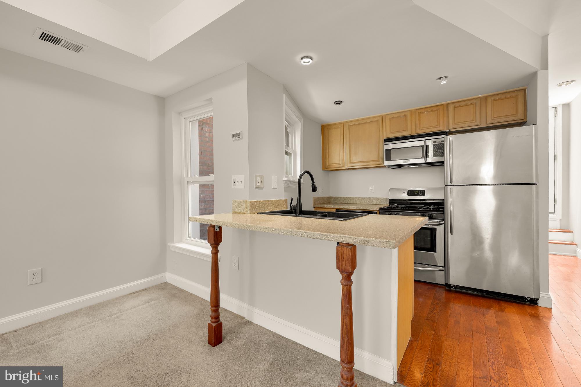 601 L Street Northeast Washington, DC 20002 - Photo 28 of 47 a kitchen with stainless steel appliances a refrigerator and a stove top oven