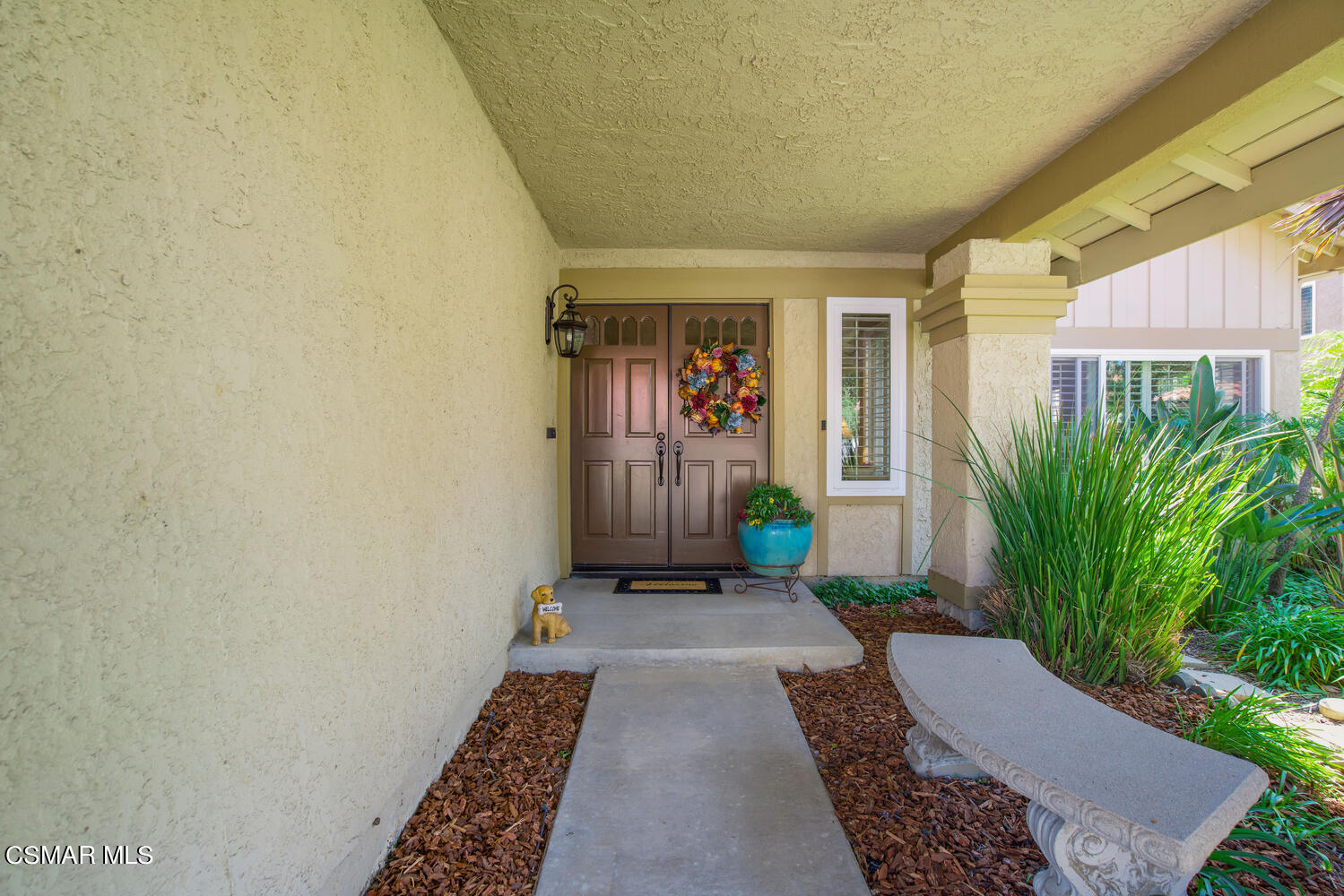 12568 Crystal Ranch Road Moorpark, CA 93021 - Photo 3 of 39 a front view of a house with a yard