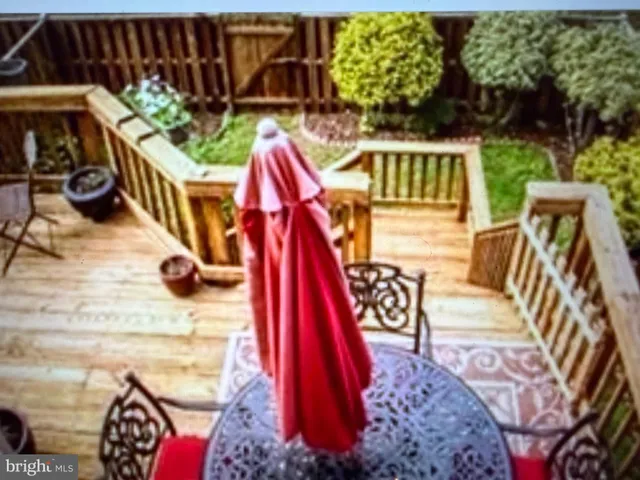 a view of front door and wooden stairs