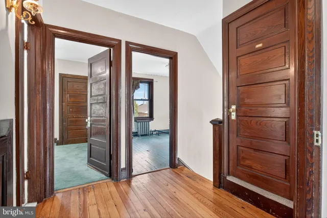 a spacious bedroom with a bed and a window