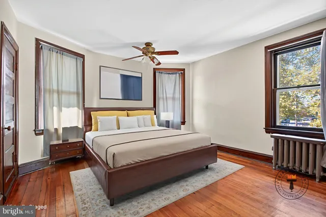 an empty room with windows and closet