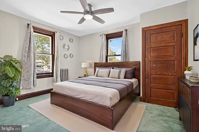 a living room with window and a wooden floor
