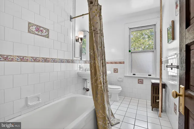 a bedroom with furniture and window