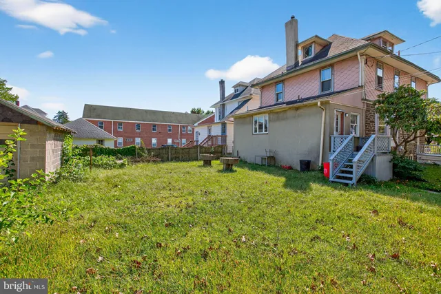 a view of a swimming pool with a yard