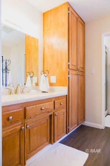 600 Las Posas Street Ridgecrest, CA 93555 - Photo 18 of 35 a bathroom with a double vanity sink and a mirror