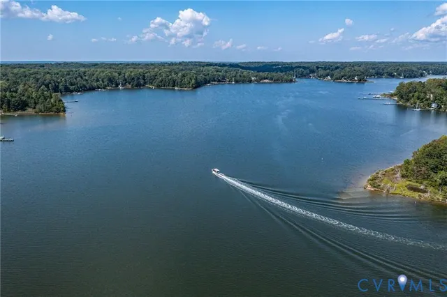 a view of a lake in middle of forest