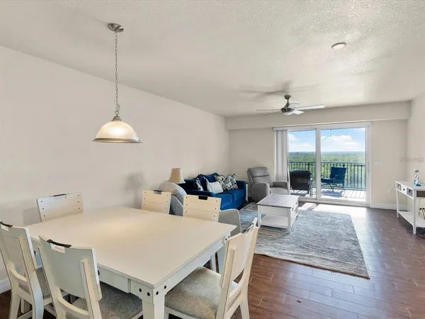 a kitchen with granite countertop a sink a stove and cabinets