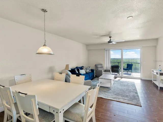 a kitchen with granite countertop a sink a stove and cabinets
