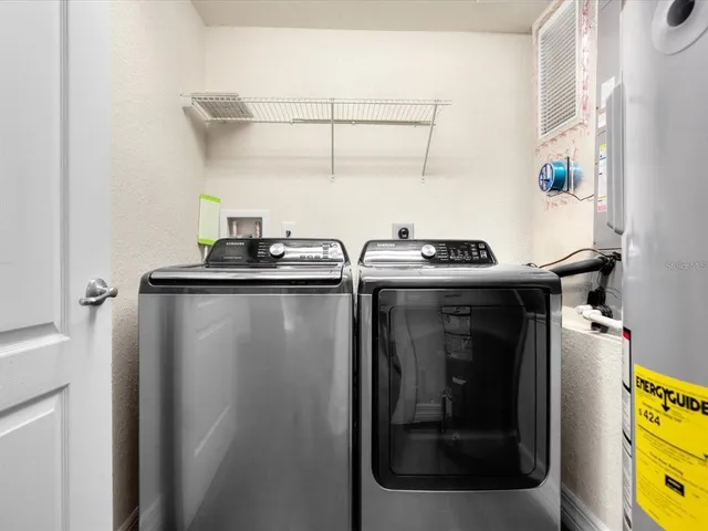 a bathroom with a sink a toilet and a shower curtain