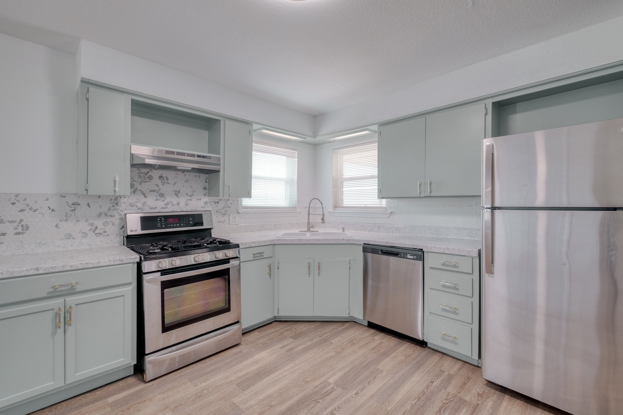 20960 Cameron Road Coupland, TX 78615 - Photo 8 of 21 Clean lines and durable finishes define this updated kitchen with corner sink configuration.