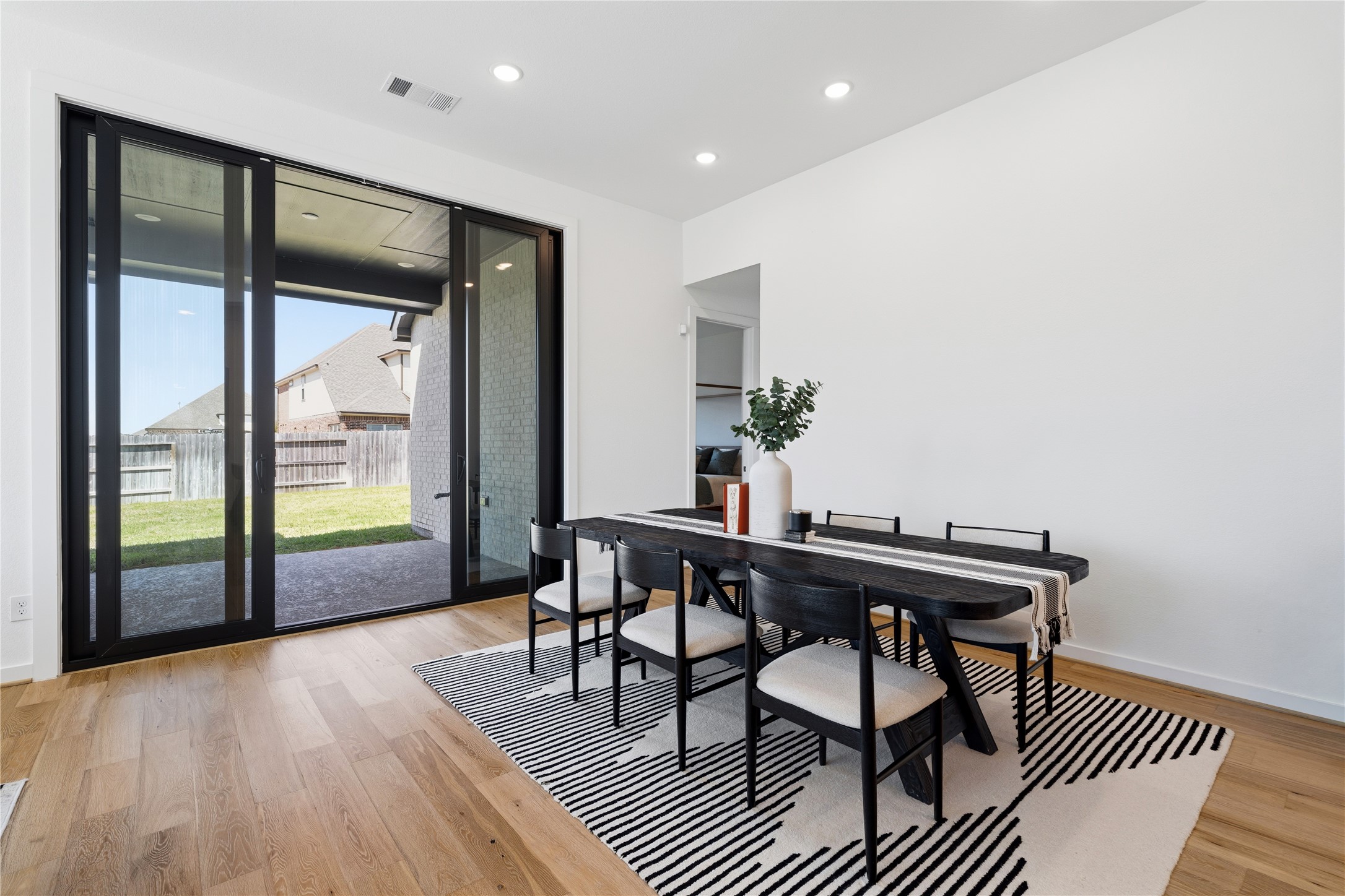 416 Bartlett Street Webster, TX 77598 - Photo 12 of 49 Dining area with 10-foot sliding glass door opening to covered patio