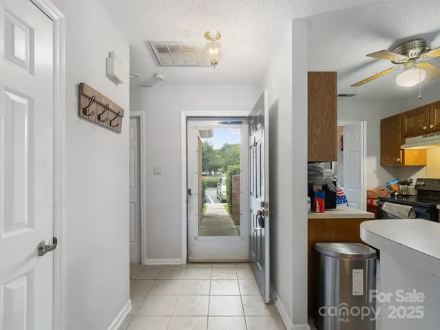 a view of a livingroom with furniture and front door