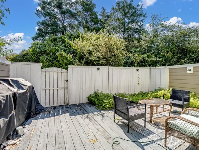 a view of backyard with a table and chairs