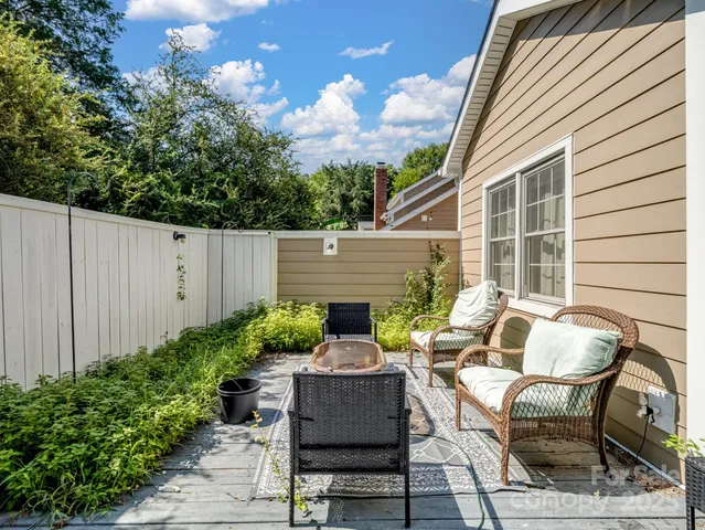 a view of a patio with couple of chairs