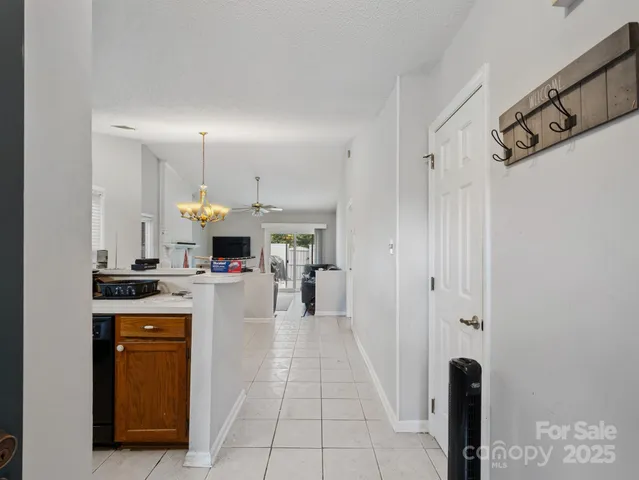 a kitchen with stainless steel appliances a stove refrigerator and a sink