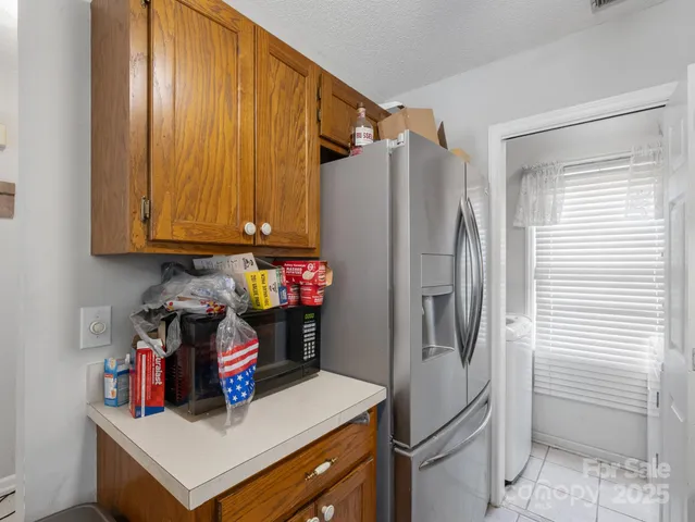 a kitchen with stainless steel appliances a refrigerator and a stove