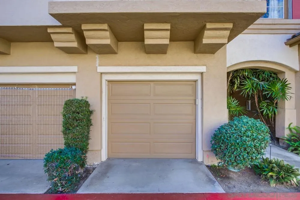 12490 Heatherton Court, Unit 10 San Diego, CA 92128 - Photo 30 of 39 a front view of a house with garden